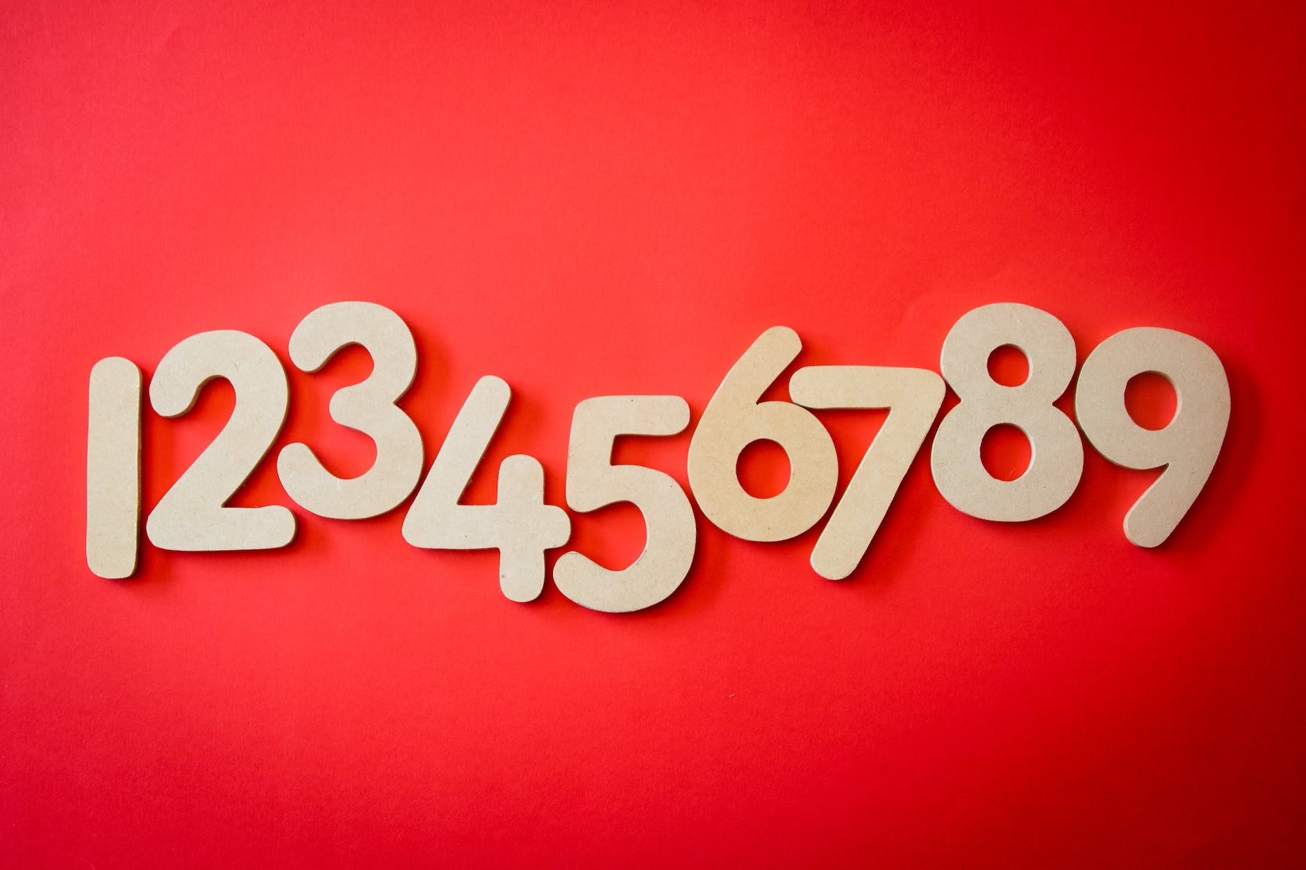 1-8 numbers in yellow on a red background for destiny number in numerology